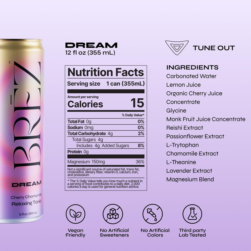 BRĒZ Dream en mesa junto a libro y vela creando ambiente de calma