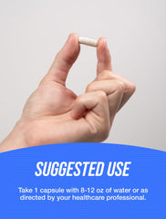 BulkSupplements cápsula junto a una moneda para escala, tamaño claro