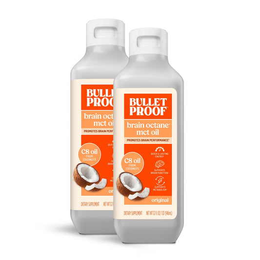 Bulletproof Coconut Brain Octane C8 MCT Oil bottle pour, ready for coffee.