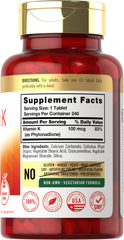 Carlyle tableta de Vitamina K en primer plano con textura y facilidad de ingestión