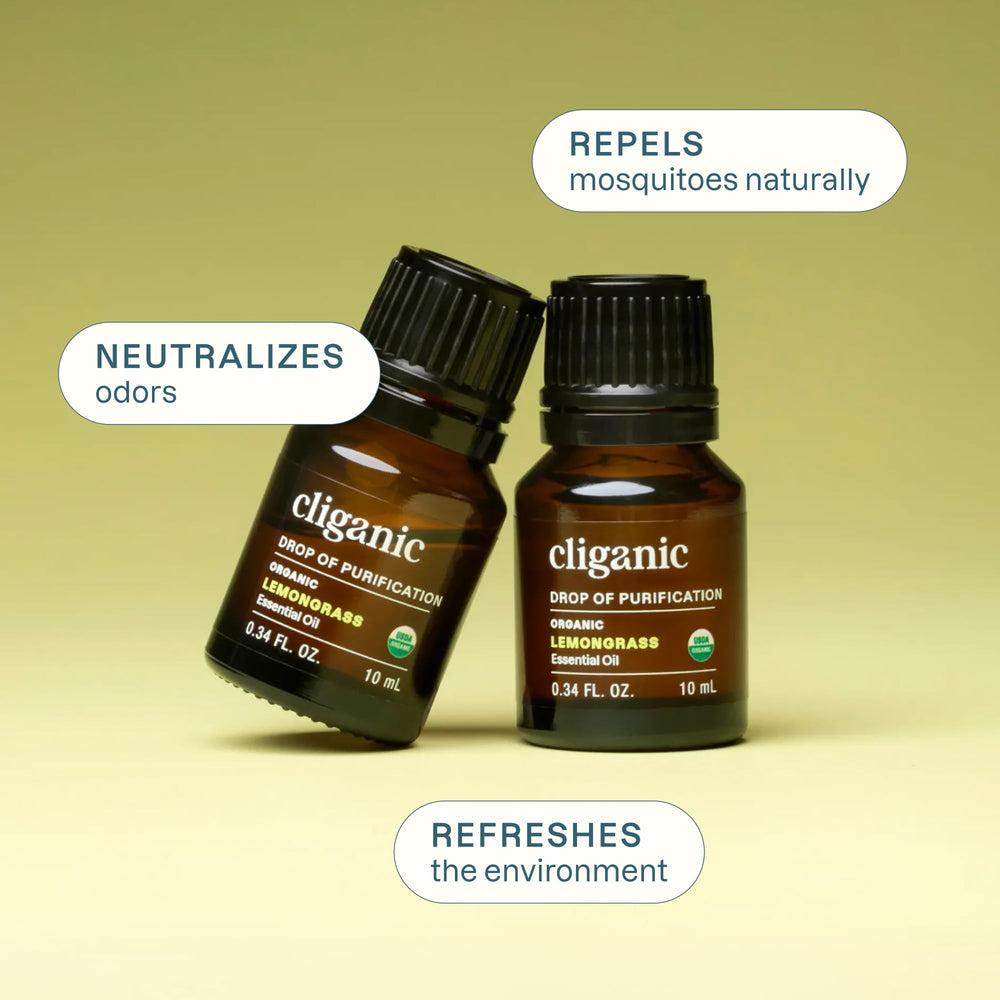 Comparación de tamaño de la botella Cliganic al lado de una mano para escala práctica
