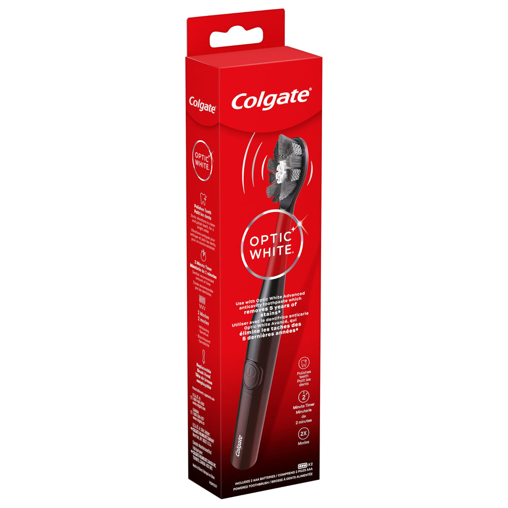 Colgate tamaño del cepillo comparado con una mano para escala real