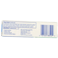 Crest pasta aplicada en cepillo para viaje mostrando uso práctico y frescura