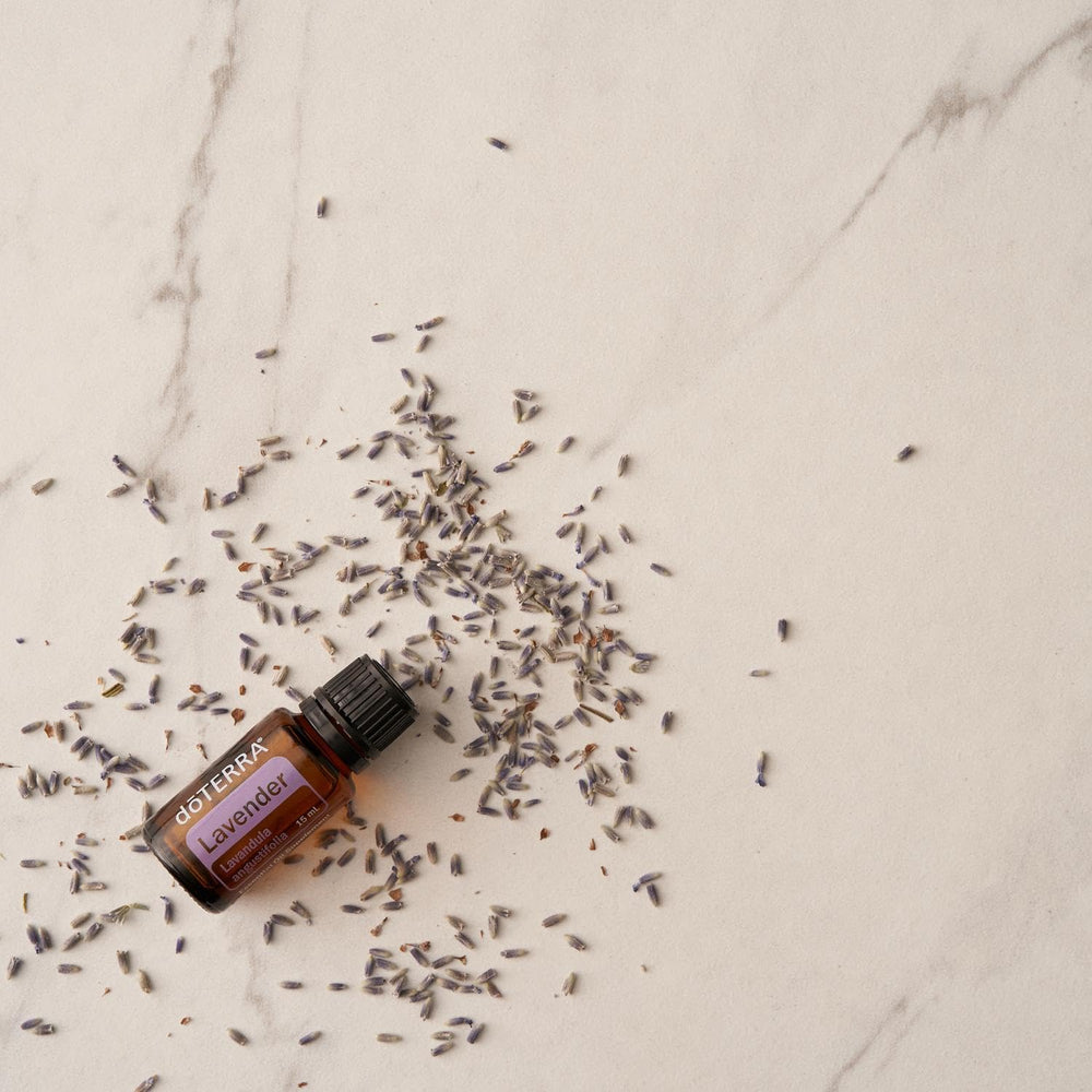doTERRA comparación de tamaño 15 ml junto a una moneda