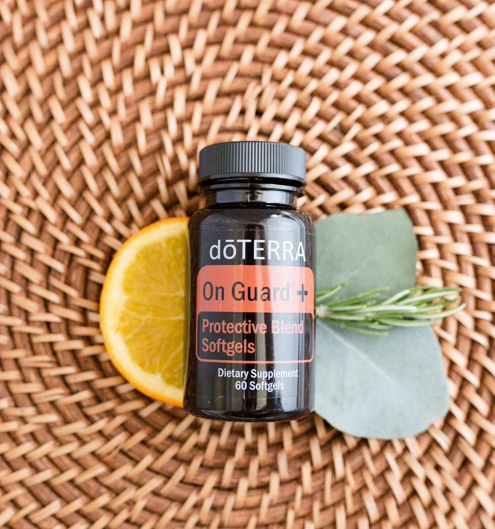 doTERRA frasco abierto On Guard+ liberando aroma energizante al abrir