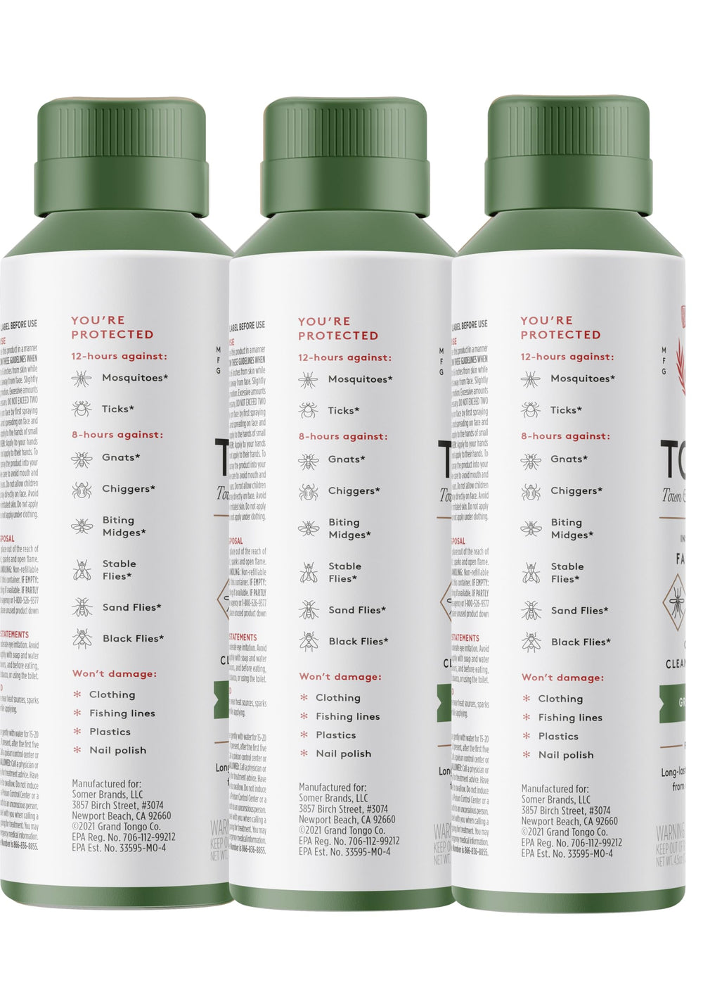 Grand Tongo familia en picnic usando el repelente para actividades