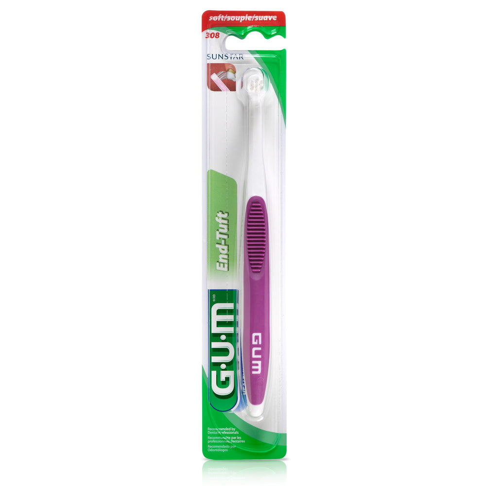 GUM cepillo en uso alcanzando muela trasera beneficiando higiene focal
