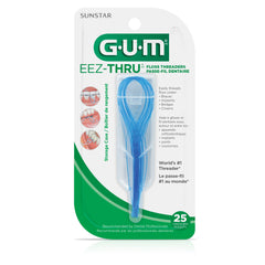 GUM Eez-Thru comparación de tamaño con monedas y estuche portátil para viaje