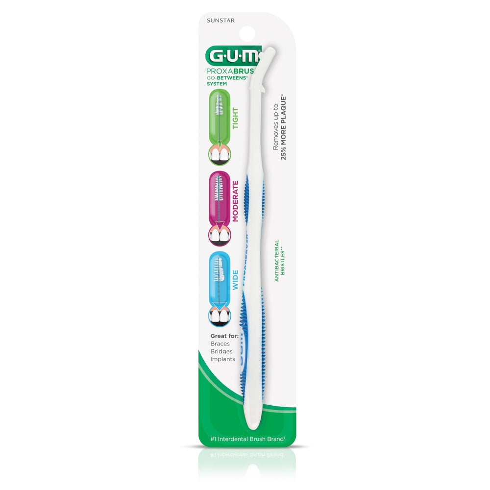 GUM Proxabrush en uso alrededor de brackets mostrando limpieza segura