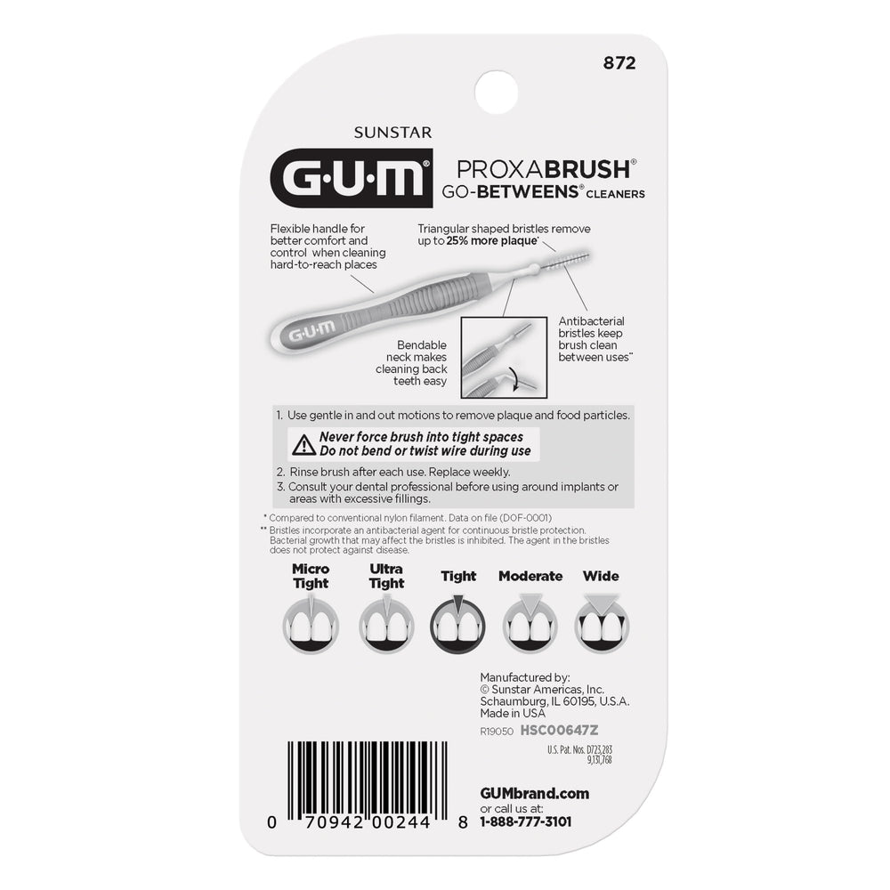 GUM Proxabrush junto a una moneda para mostrar tamaño compacto y portabilidad
