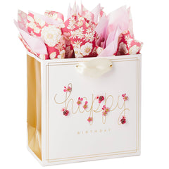 Hallmark bolsa frontal con flores rosas y mensaje dorado, aspecto festivo