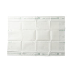 Medline protector colocado en cama demostrando protección contra fugas
