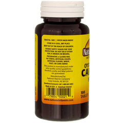 Nature's Blend oyster shell calcium tablets close-up on compact, unflavored tablet.