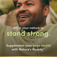 Nature's Bounty softgels junto a una regla para comparar tamaño y facilidad de tragar