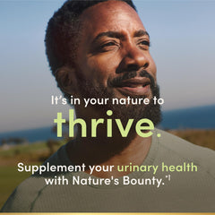 Nature's Bounty cápsulas junto a desayuno, uso diario conveniente
