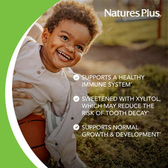NaturesPlus comparación de tamaño de las tabletas junto a una moneda para escala