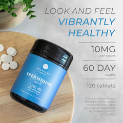 Neurogan Spermidina: cápsulas en la mano, indicación de uso diario para apoyo celular.