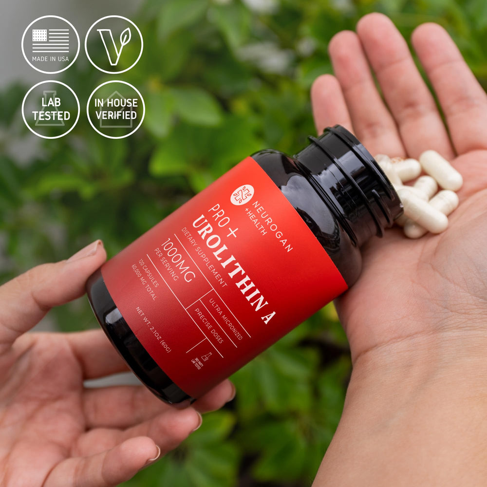 Open bottle with Neurogan Urolithin A Pro capsules ready to take.