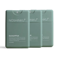 Noshinku paquete frontal mostrando tres sprays recargables y beneficio ecológico