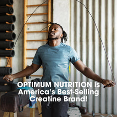 Optimum Nutrition comparación de tamaño de cápsula junto a una moneda para escala