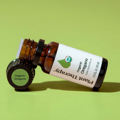 Plant Therapy frasco 10 mL junto a una moneda para comparar tamaño, fácil almacenamiento