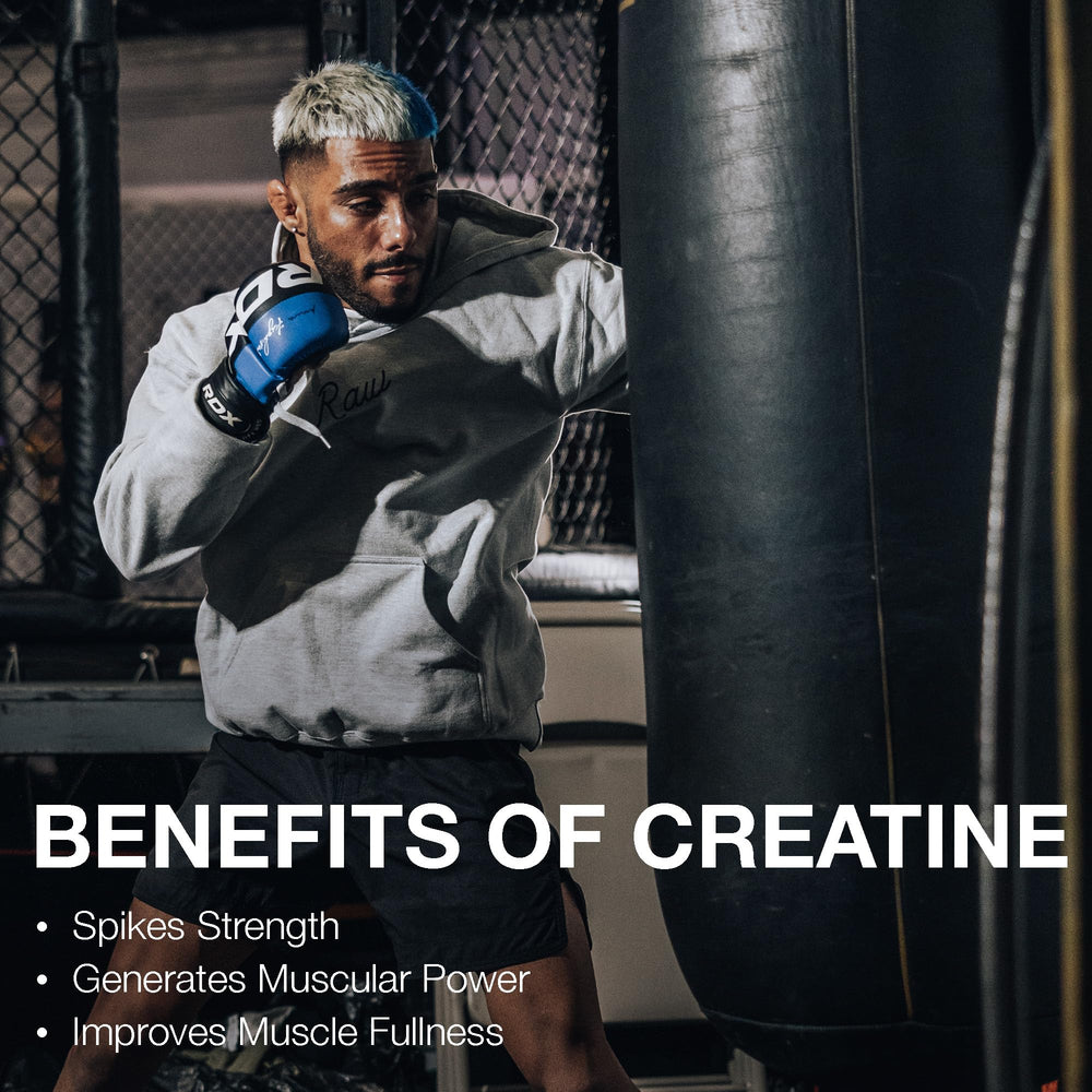 RAW Nutrition creatine monohydrate powder in a glass of water for quick dissolution