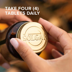 Solgar Calcio Avanzado Complex botella abierta, tabletas listas para tomar.