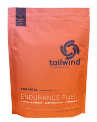 Tailwind Nutrition mezcla Tropical Buzz disolviéndose clara en agua hidratación rápida