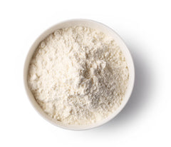 Terrasoul Superfoods el envase 12oz junto a una taza para comparar tamaño