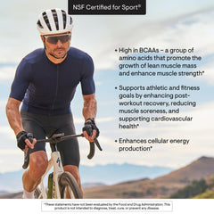 THORNE Amino Complex berry in glass illustrating easy mix with water.