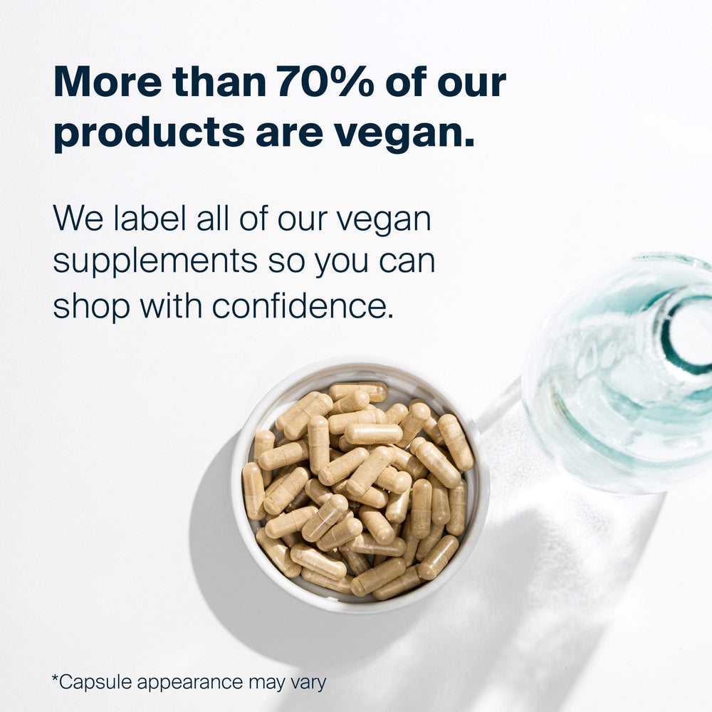 Vital Nutrients bottle beside a glass of tea suggesting daily immune support