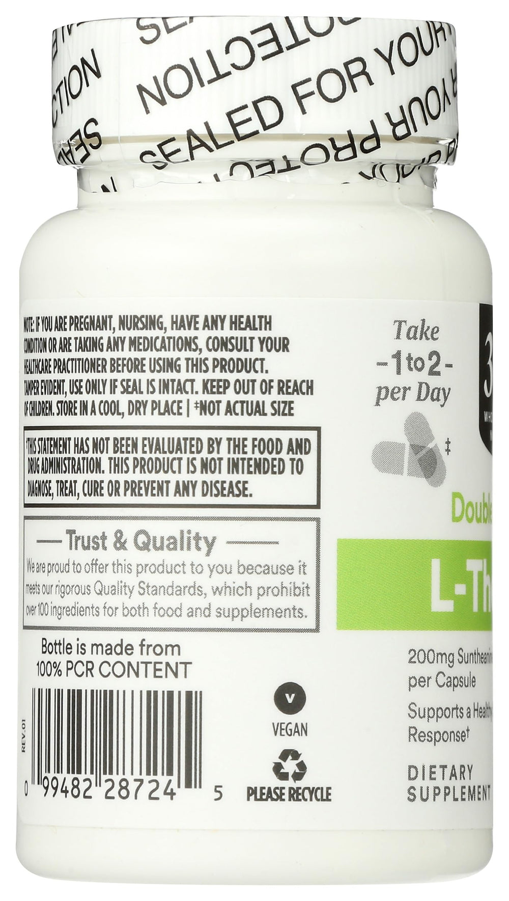 Comparación de tamaño del frasco 365 by Whole Foods Market con mano