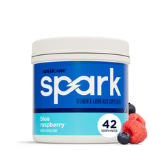 AdvoCare envase frontal Spark frambuesa azul mostrando marca y presentación, ofrece energía portátil