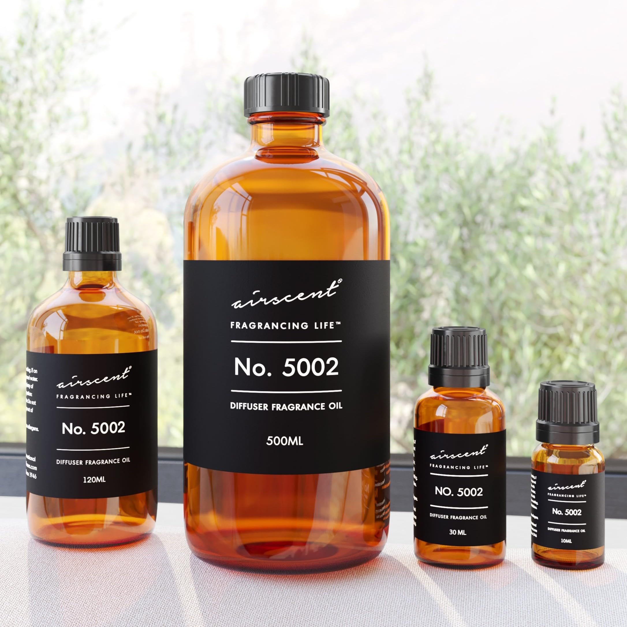 Air-Scent frasco en mano para comparar tamaño y control de dosis fácil