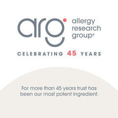 Allergy Research Group producto en mesa junto a frutas para estilo de vida sano