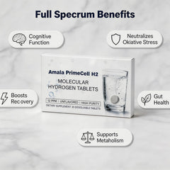Tableta Amala PrimeCell H2 efervesciendo en vaso creando agua rica en hidrógeno