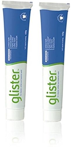 Amway Glister frente del empaque mostrando pack de dos tubos y beneficio de limpieza