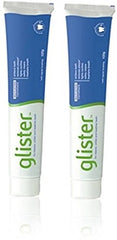 Amway Glister frente del empaque mostrando pack de dos tubos y beneficio de limpieza