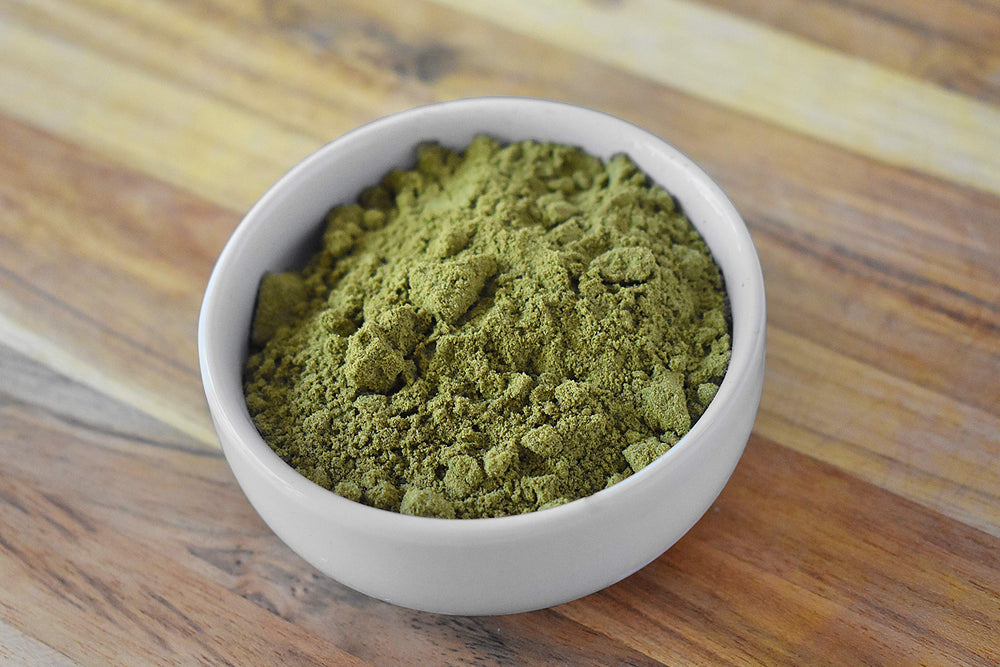 Anthony's Organic Hemp Seed Protein Powder with a scoop emphasizes easy measuring