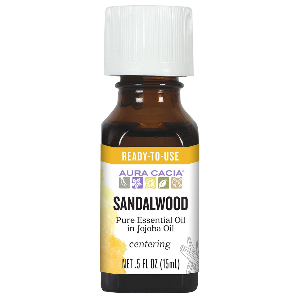 Aura Cacia frontal del envase mostrando la mezcla lista y beneficios aromáticos
