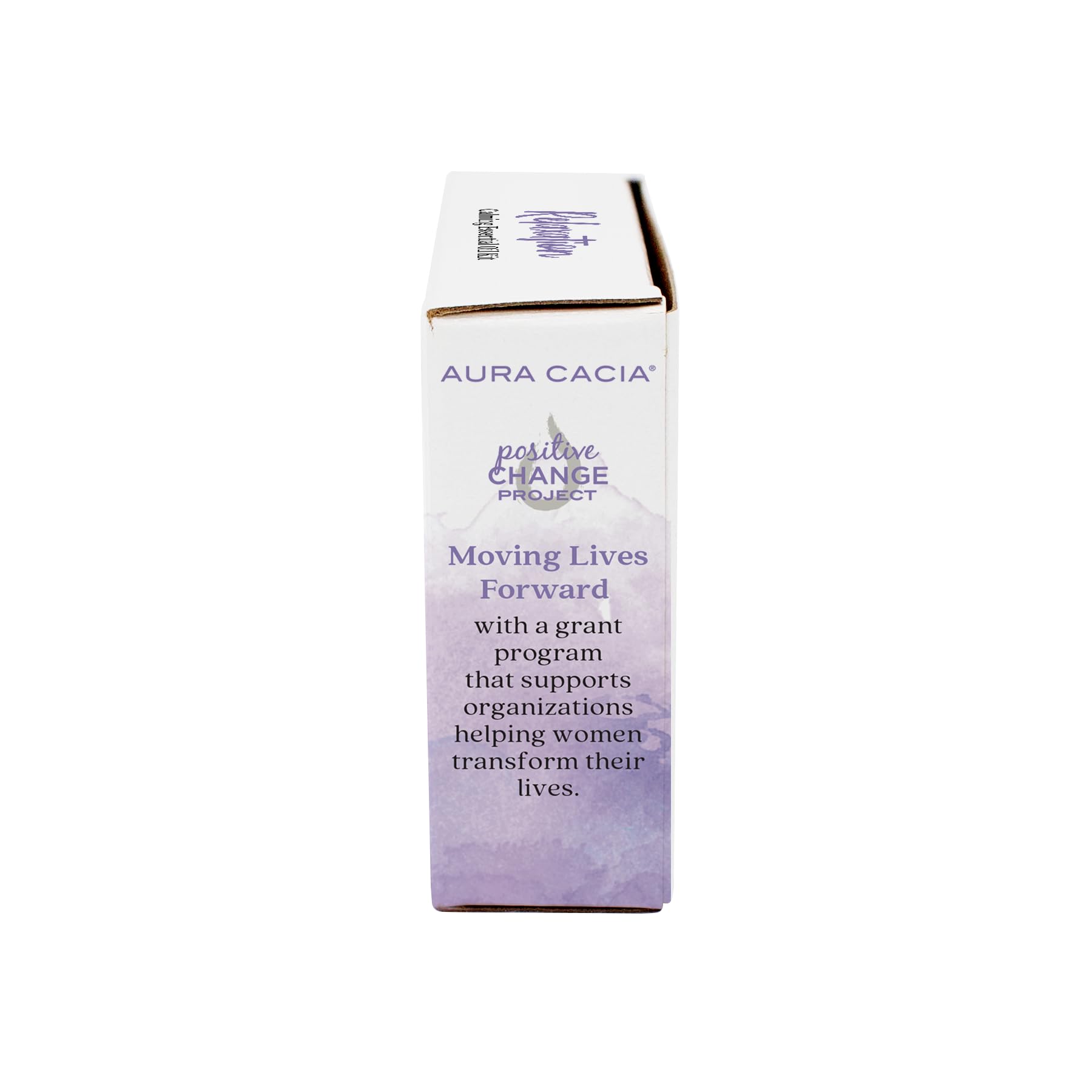 Aura Cacia aceite en difusor sobre mesa de salón creando ambiente acogedor