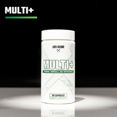 Axe & Sledge multivitamínico junto a una moneda para comparar tamaño y conveniencia de 90 cápsulas