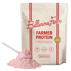 Ballerina Farm frasco frontal del polvo Strawberry Crème mostrando la marca y beneficio de proteína limpia