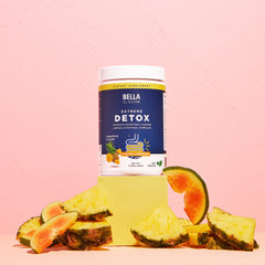 Bella All Natural producto junto a regla para referencia de tamaño
