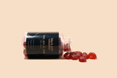 Black Girl Vitamins bote abierto revelando gomitas sabor maracuyá