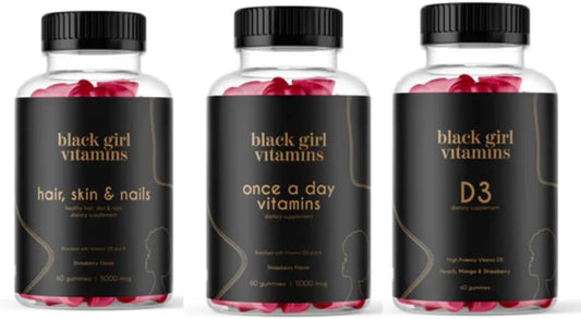 Black Girl Vitamins frontal del paquete mostrando las tres botellas y beneficios