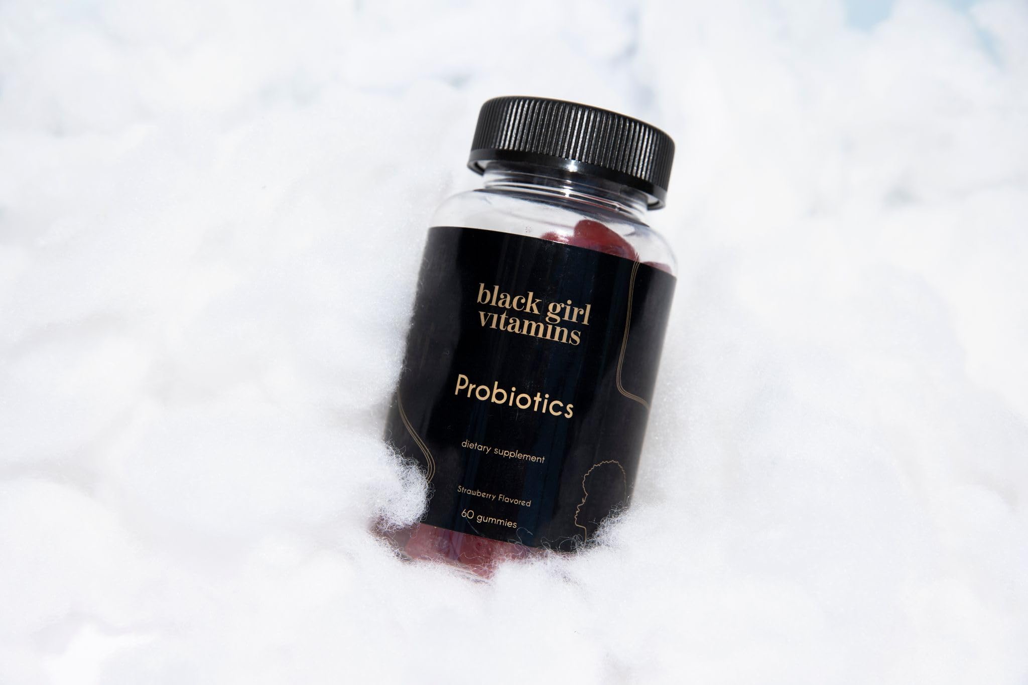 Black Girl Vitamins persona tomándose una gomita estilo de vida rutina diaria saludable