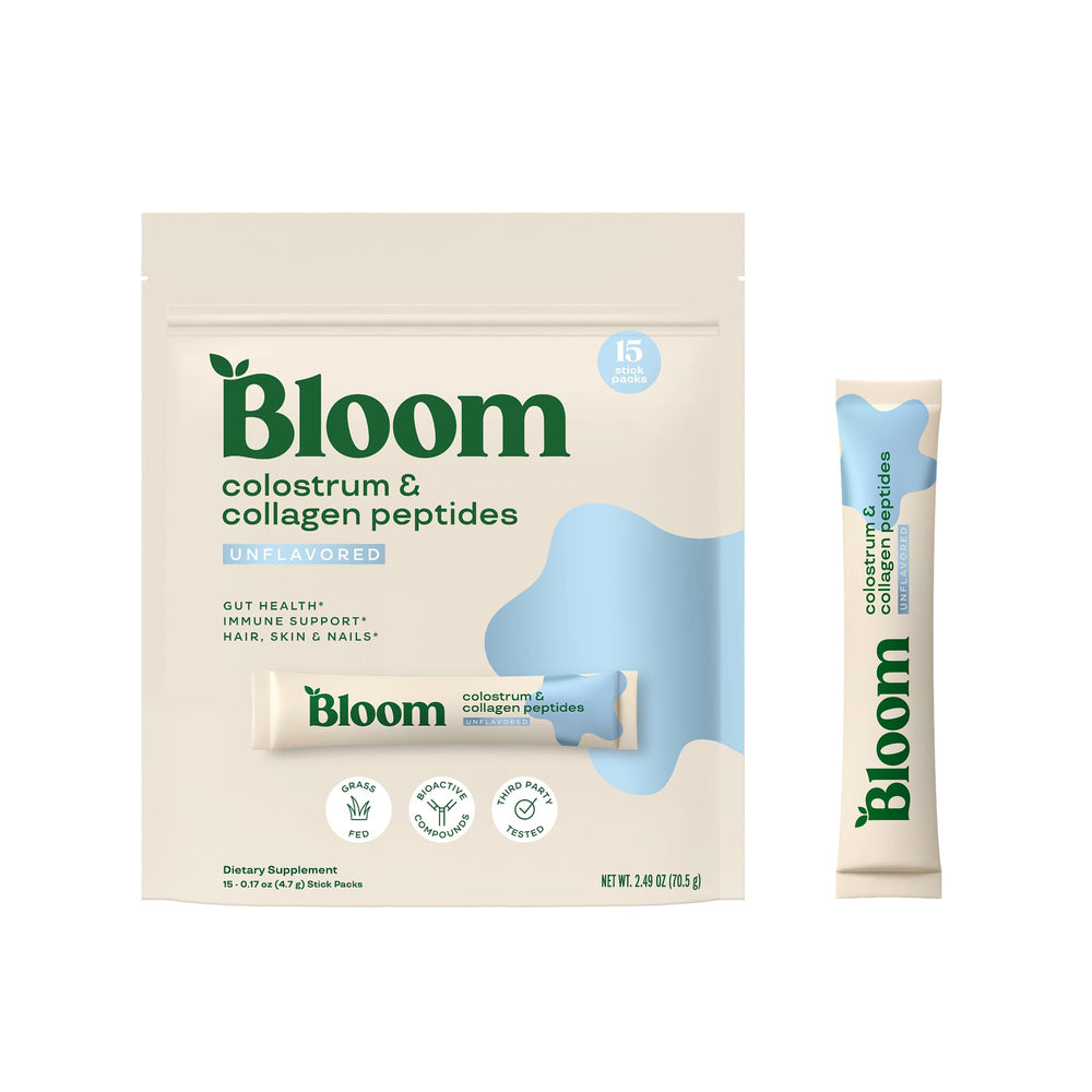 Bloom Nutrition envase frontal del colostro sin sabor mostrando marca y diseño