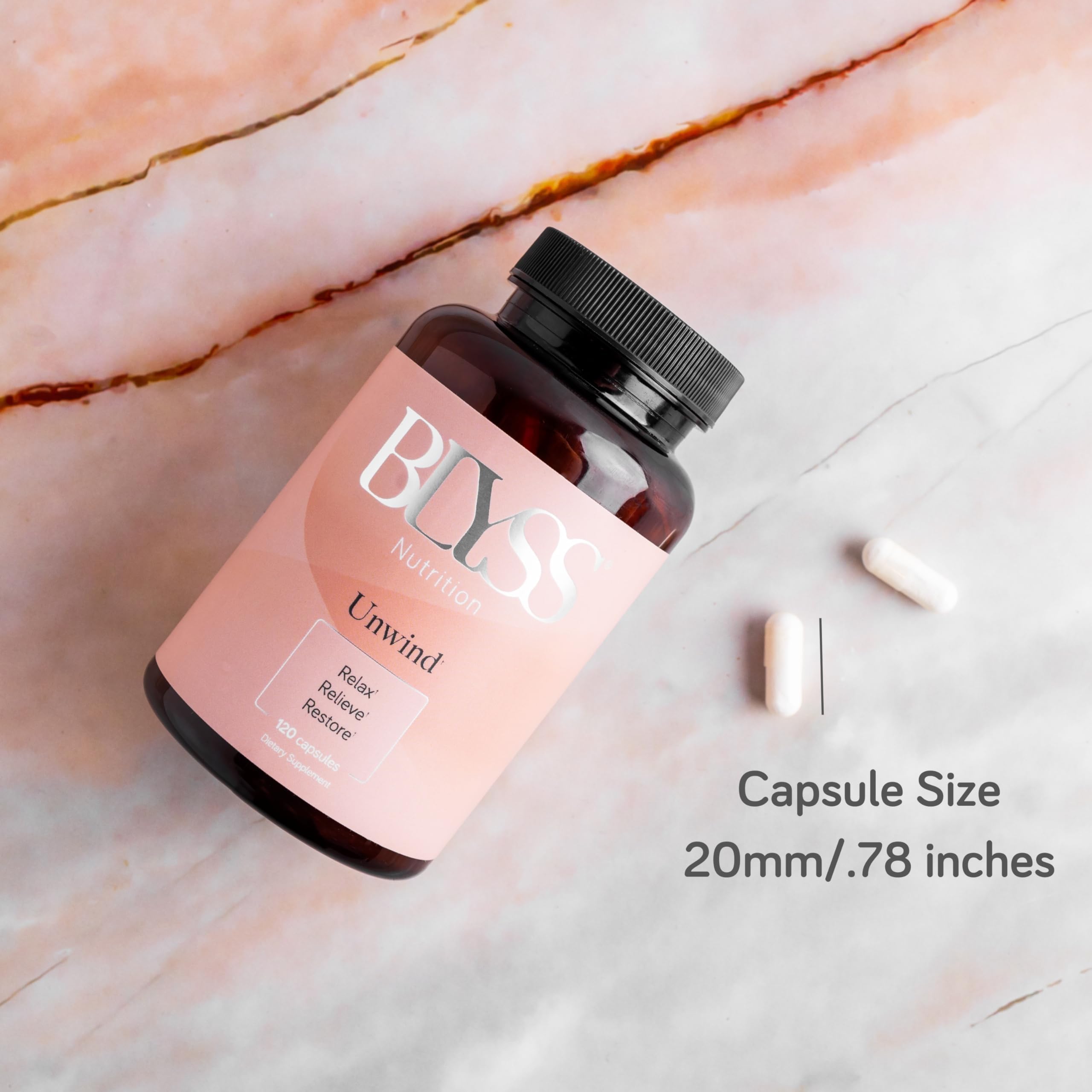 BLYSS Nutrition cápsulas en la palma de la mano para escala y dosificación