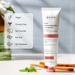 Boka tubo abierto dispensando crema que ilustra baja formación de espuma